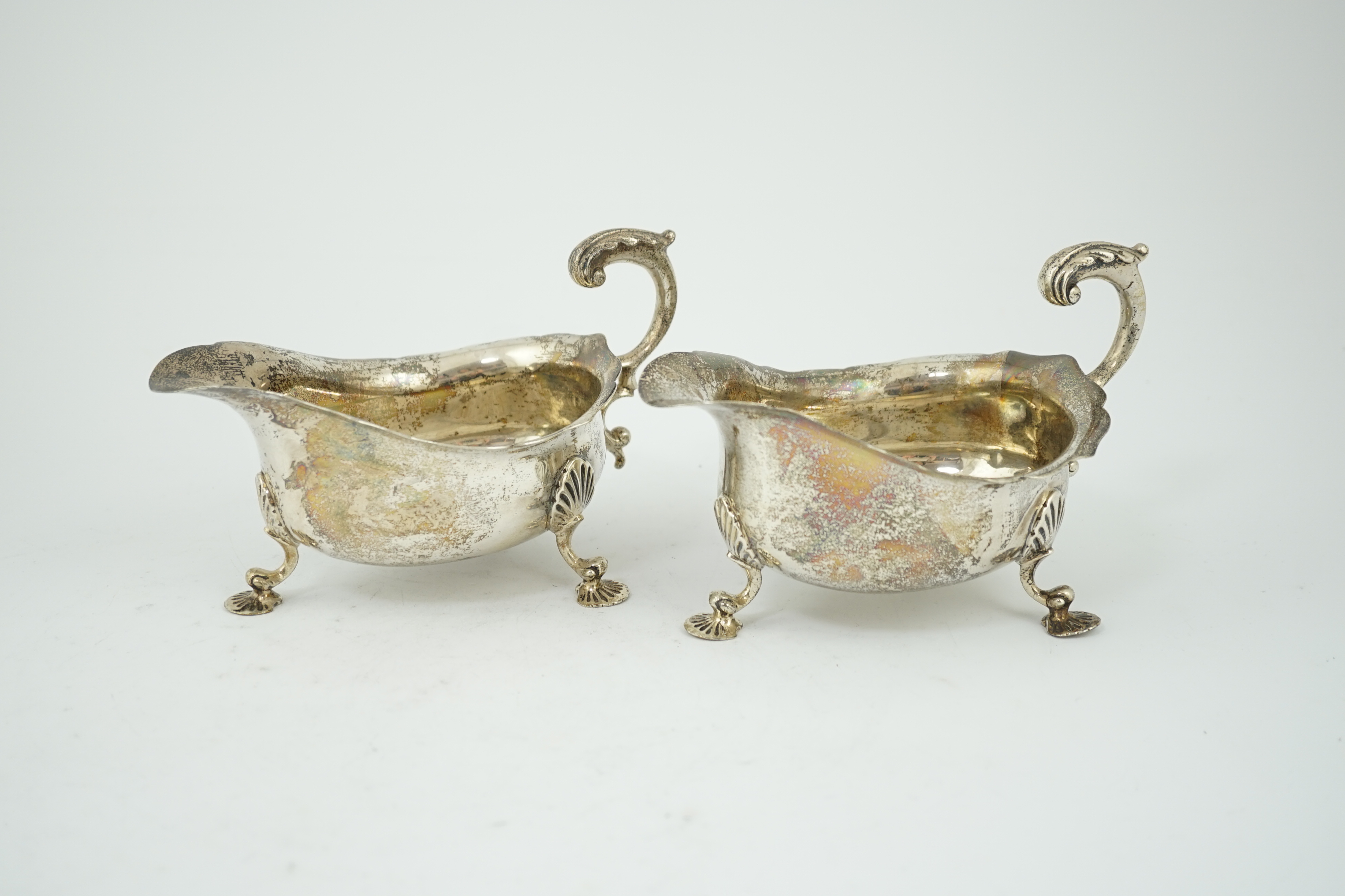 A pair of George V silver sauceboats, by Harrod's Ltd